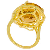 Oval yellow citrine sterling silver ring featuring a sparkling gemstone with intricate design details.